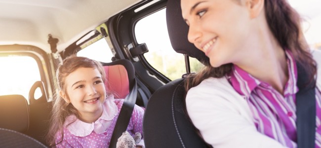 Mom-in-Driver-Seat-Looking-Back-at-Young-Girl