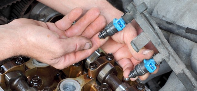 Mechanic-Inspecting-Fuel-Injectors