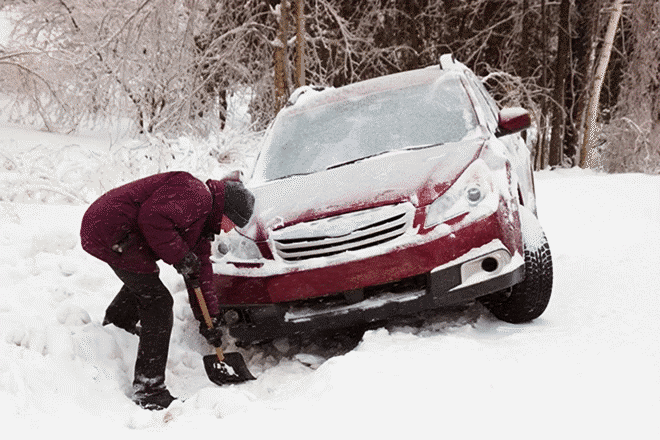 man-digging-car-out-of-snow